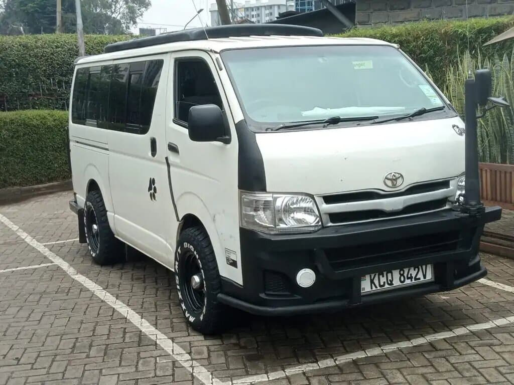 White Toyota HiAce safari minivan with Kenyan registration plates KCQ 842V